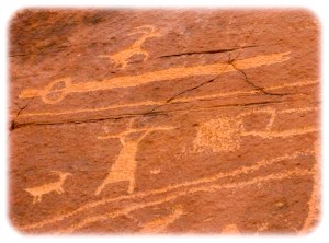 Petroglyphs including atlatl